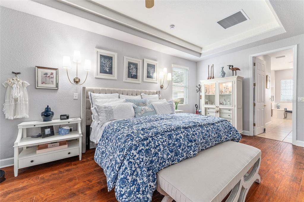 12895 Southeast 91st Terrace Road Summerfield, FL 34491 - Photo 36 of 99 a bedroom with a bed and a table in it