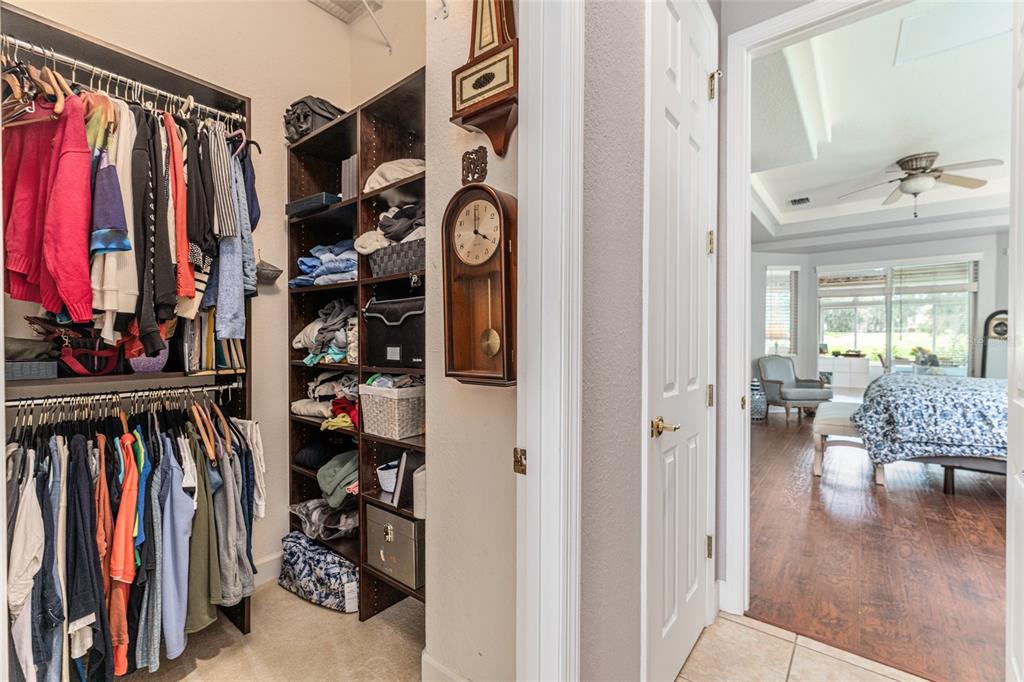12895 Southeast 91st Terrace Road Summerfield, FL 34491 - Photo 40 of 99 a view of walk in closet with clothes and shoes