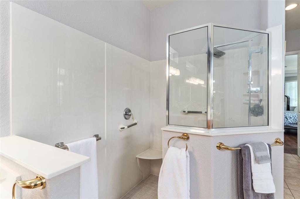 12895 Southeast 91st Terrace Road Summerfield, FL 34491 - Photo 46 of 99 a bathroom with a shower and a sink