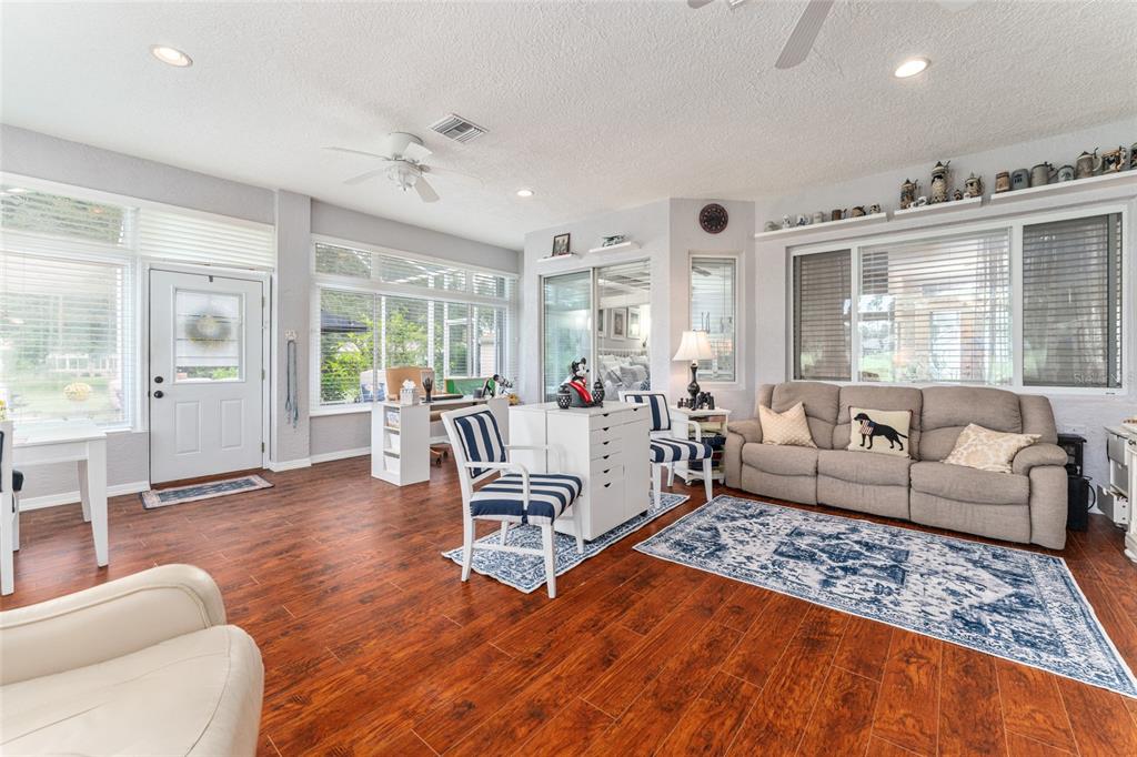 12895 Southeast 91st Terrace Road Summerfield, FL 34491 - Photo 57 of 99 a living room with furniture and a large window