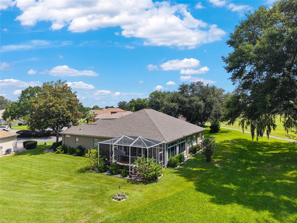 12895 Southeast 91st Terrace Road Summerfield, FL 34491 - Photo 79 of 99 a view of a house with a big yard plants and large trees