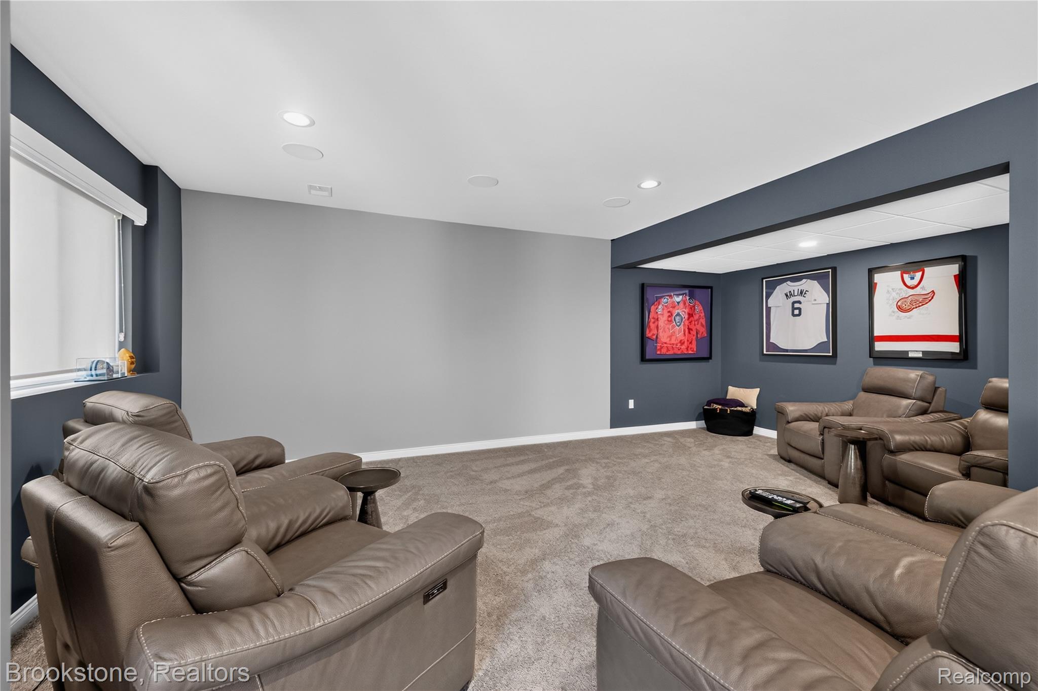 2167 Sanctuary Court Rochester, MI 48309 - Photo 60 of 68 Lower level recreation area featuring recessed lighting, in-ceiling speakers, gray carpeting, and a window with a white roller shade