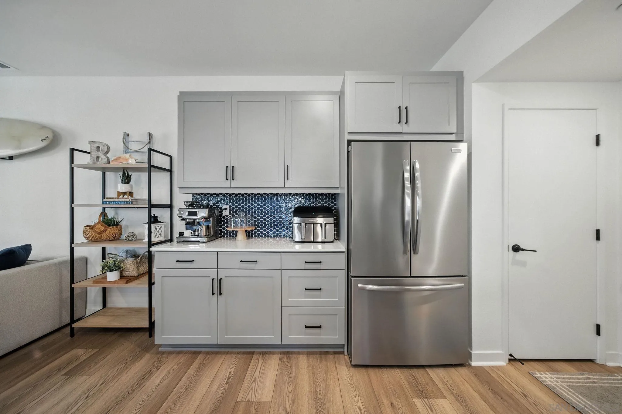 239 Blended Place Fallbrook, CA 92028 - Photo 14 of 64 a kitchen with stainless steel appliances a refrigerator sink and cabinets