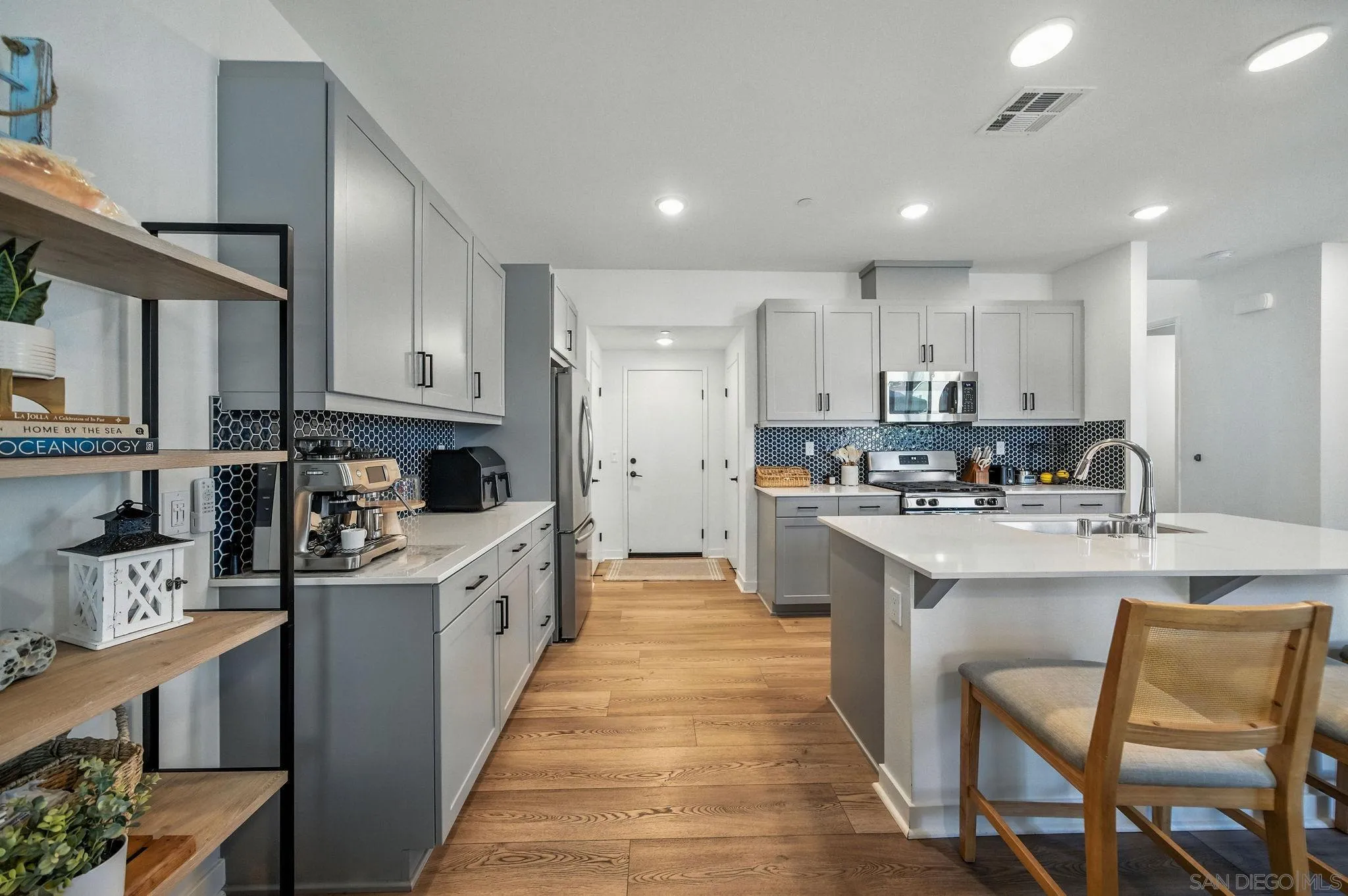 239 Blended Place Fallbrook, CA 92028 - Photo 15 of 64 a large kitchen with stainless steel appliances lots of counter space and a sink