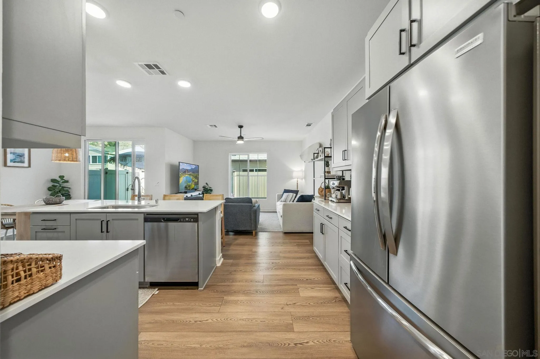239 Blended Place Fallbrook, CA 92028 - Photo 18 of 64 a kitchen with stainless steel appliances a refrigerator and a sink