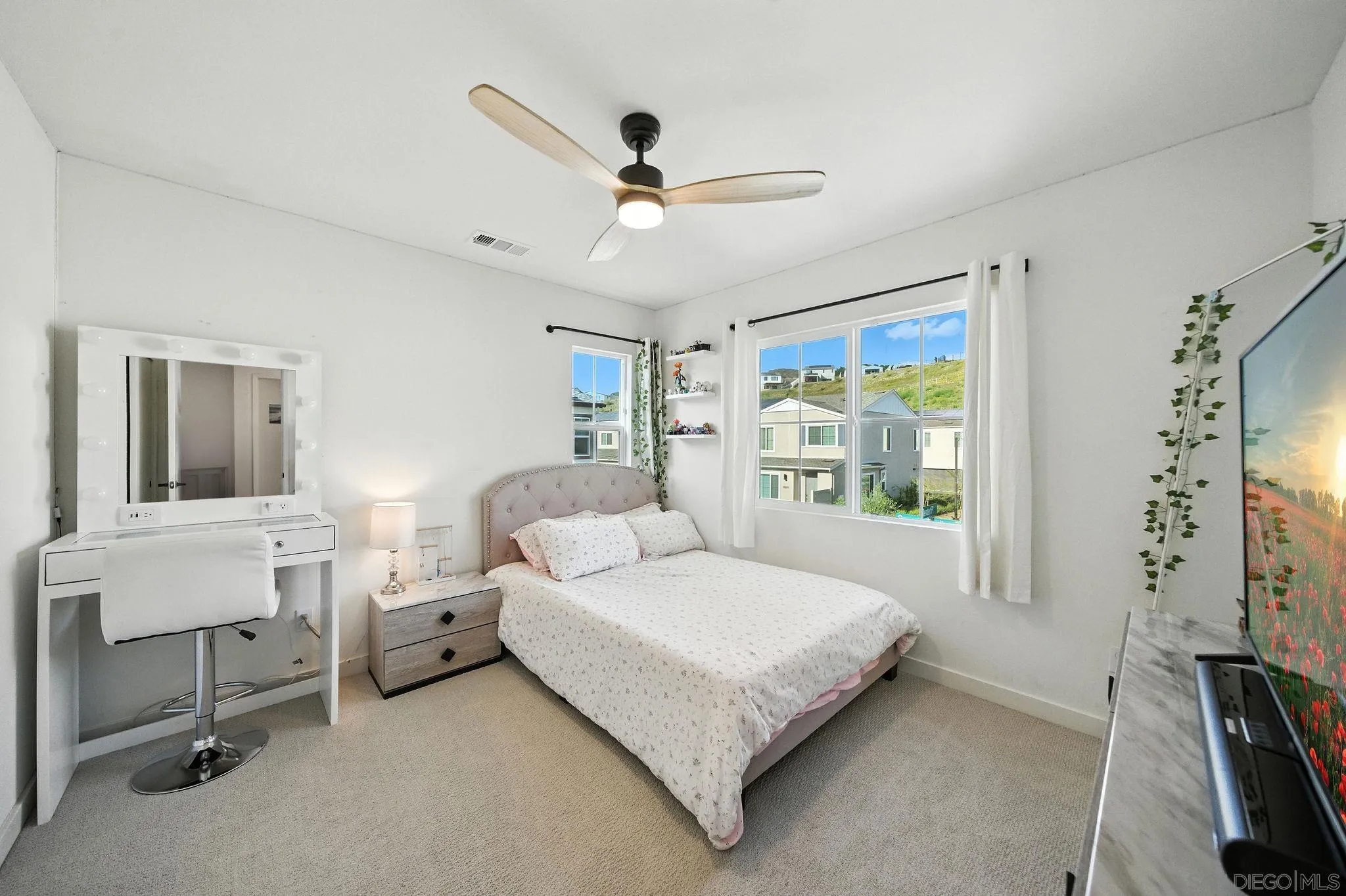 239 Blended Place Fallbrook, CA 92028 - Photo 31 of 64 a bedroom with a bed and a chandelier