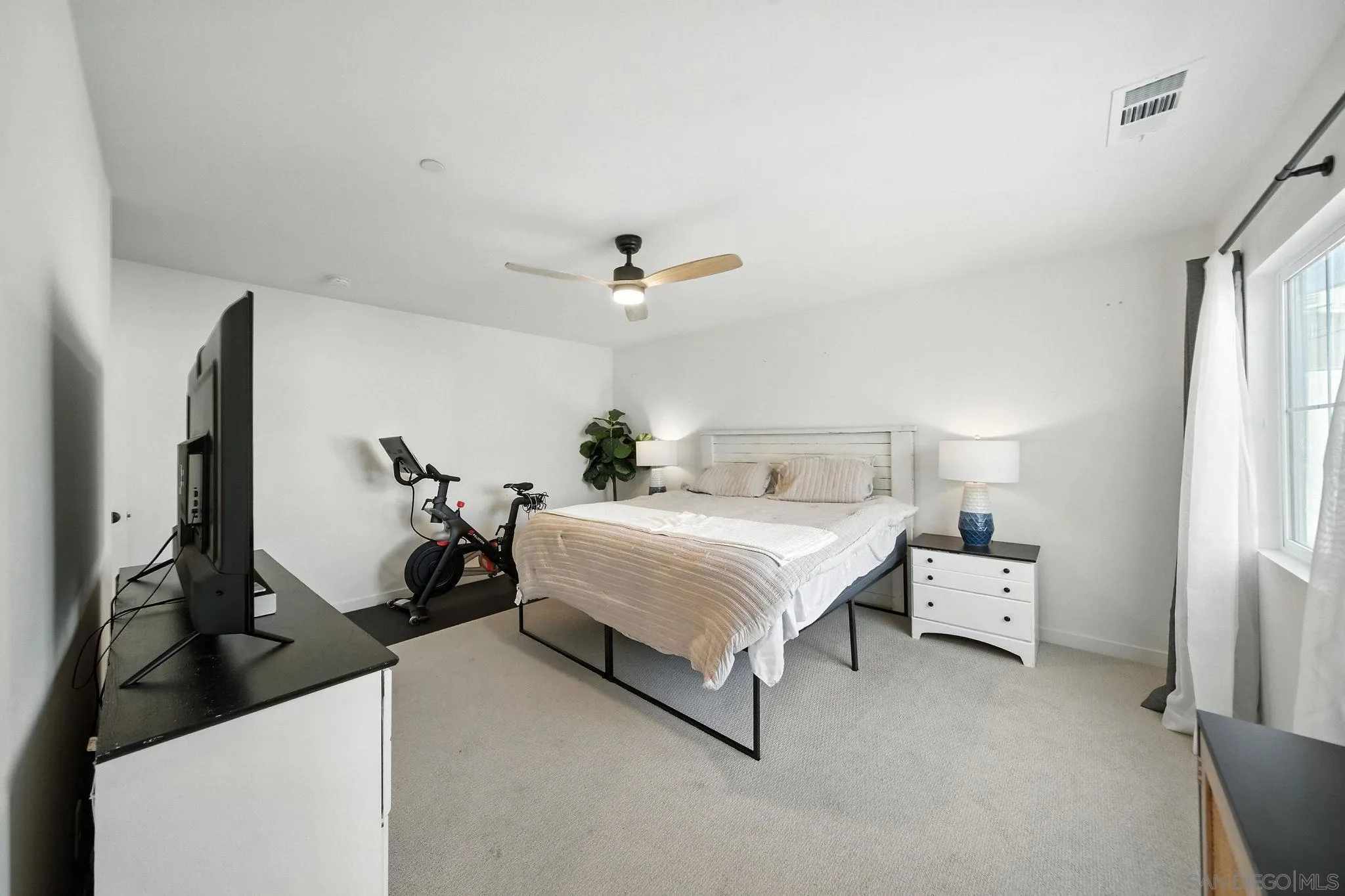 239 Blended Place Fallbrook, CA 92028 - Photo 37 of 64 a bed room with a bed and a chandelier