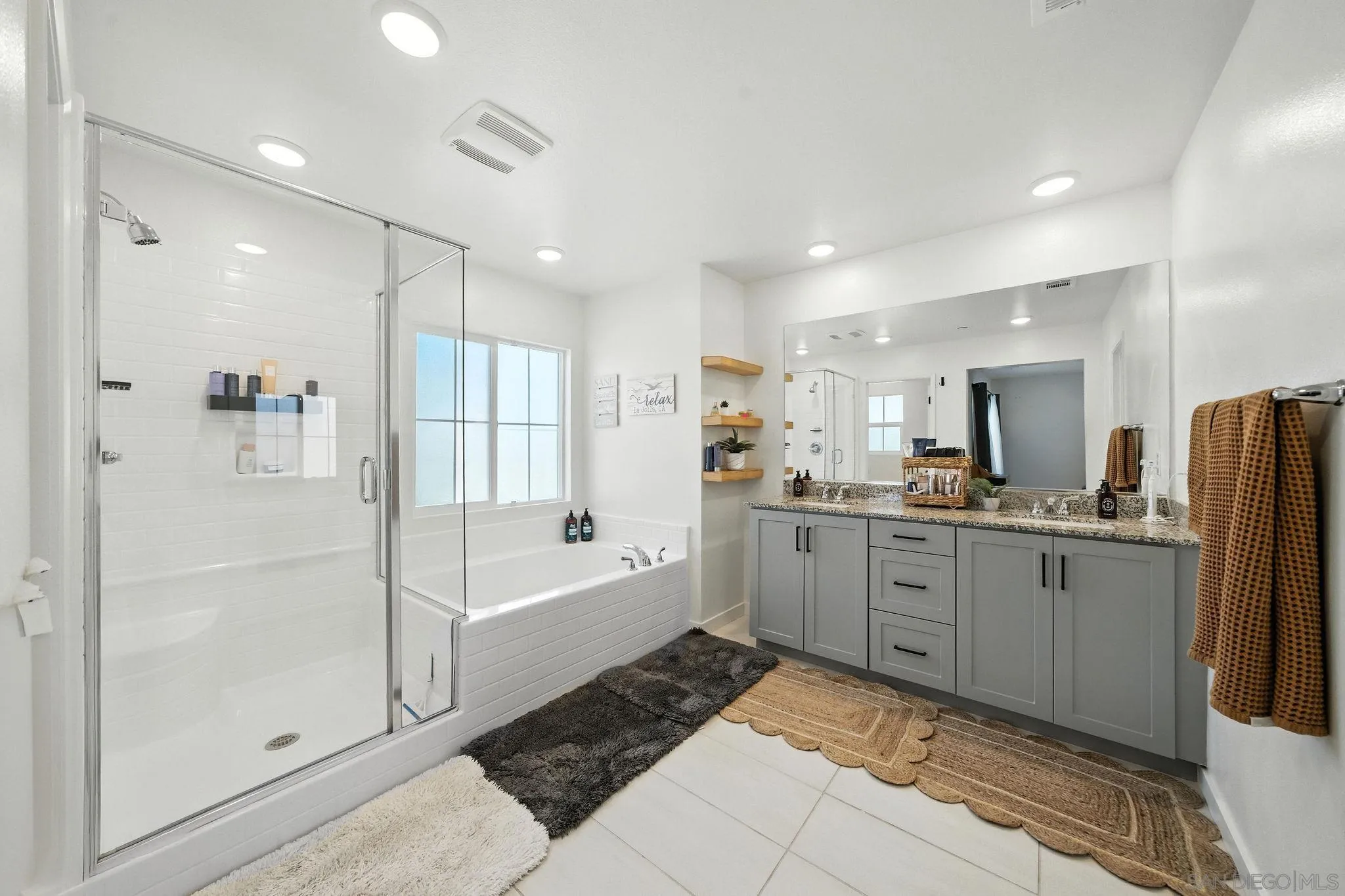 239 Blended Place Fallbrook, CA 92028 - Photo 38 of 64 a large bathroom with a tub a sink and a shower