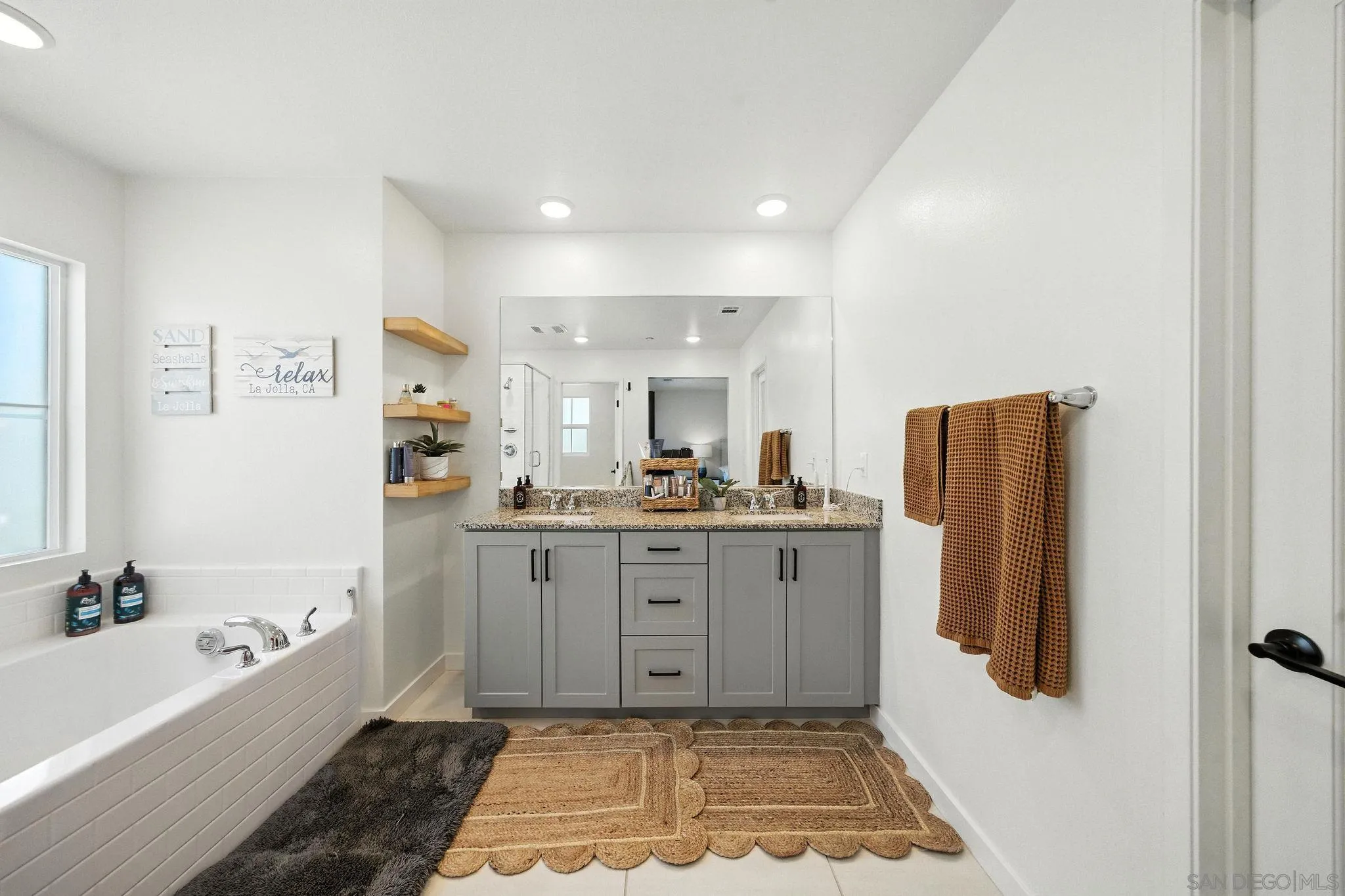 239 Blended Place Fallbrook, CA 92028 - Photo 39 of 64 a bathroom with a tub sink and mirror