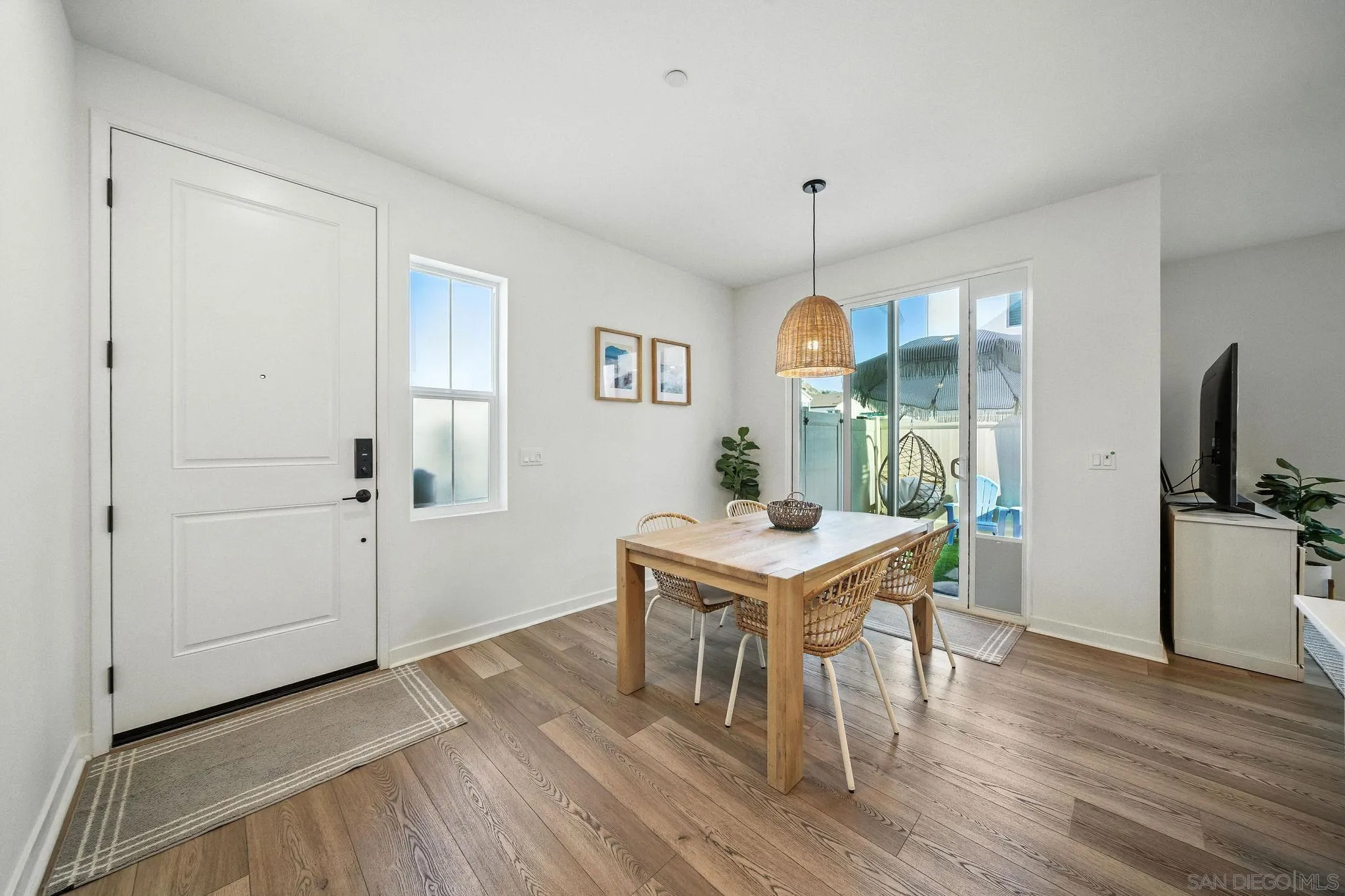 239 Blended Place Fallbrook, CA 92028 - Photo 4 of 64 a view of a dining room with furniture window and wooden floor