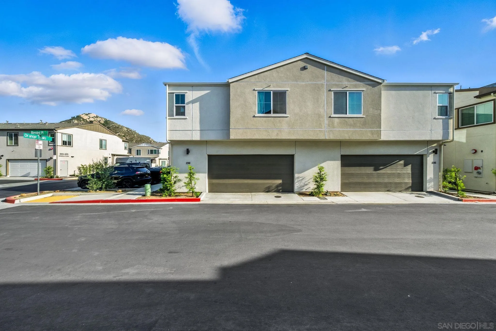 239 Blended Place Fallbrook, CA 92028 - Photo 47 of 64 a front view of a house with a yard and garage
