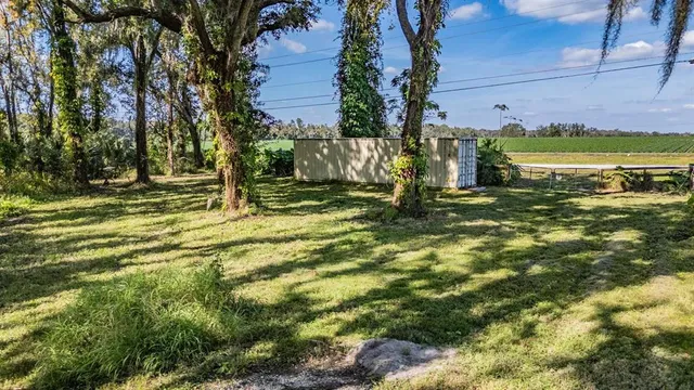 a view of a yard with an outdoor space