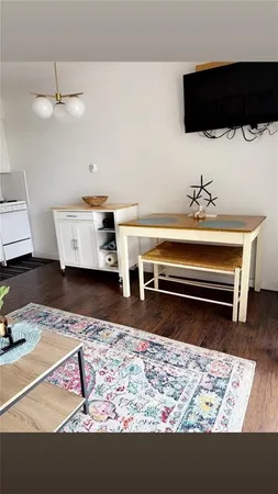a view of a living room and dining room