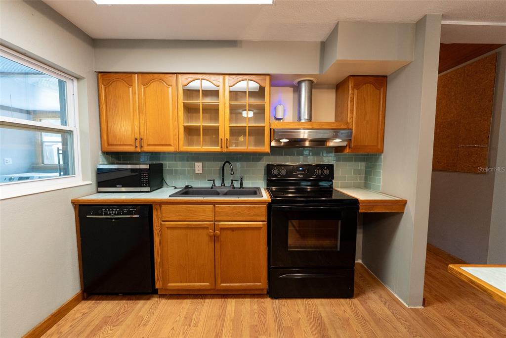 1860 Northeast 62nd Street Ocala, FL 34479 - Photo 14 of 64 a kitchen with stainless steel appliances granite countertop a stove and a sink