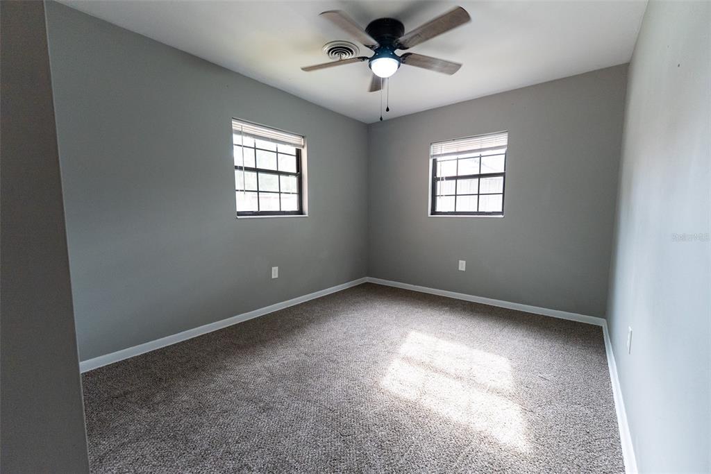 1860 Northeast 62nd Street Ocala, FL 34479 - Photo 23 of 64 a view of room with a ceiling fan and window