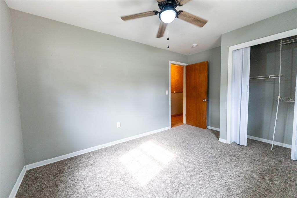 1860 Northeast 62nd Street Ocala, FL 34479 - Photo 26 of 64 an empty room with a ceiling fan and a window