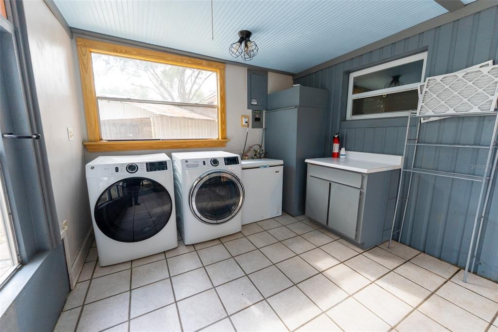 1860 Northeast 62nd Street Ocala, FL 34479 - Photo 32 of 64 a utility room with dryer and washer