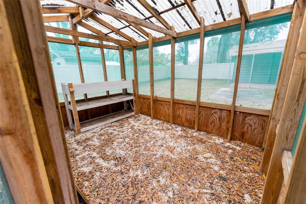 1860 Northeast 62nd Street Ocala, FL 34479 - Photo 42 of 64 a room with a bed and wooden floor