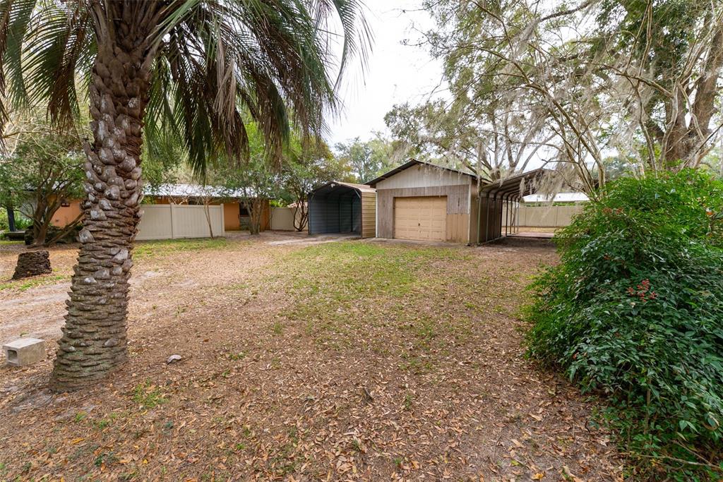 1860 Northeast 62nd Street Ocala, FL 34479 - Photo 59 of 64 a house with a tree in front of it
