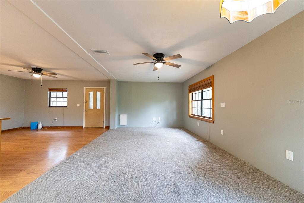 1860 Northeast 62nd Street Ocala, FL 34479 - Photo 7 of 64 a view of a livingroom with a window
