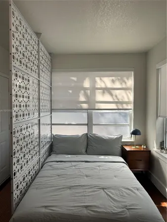 a living room with furniture and potted plant