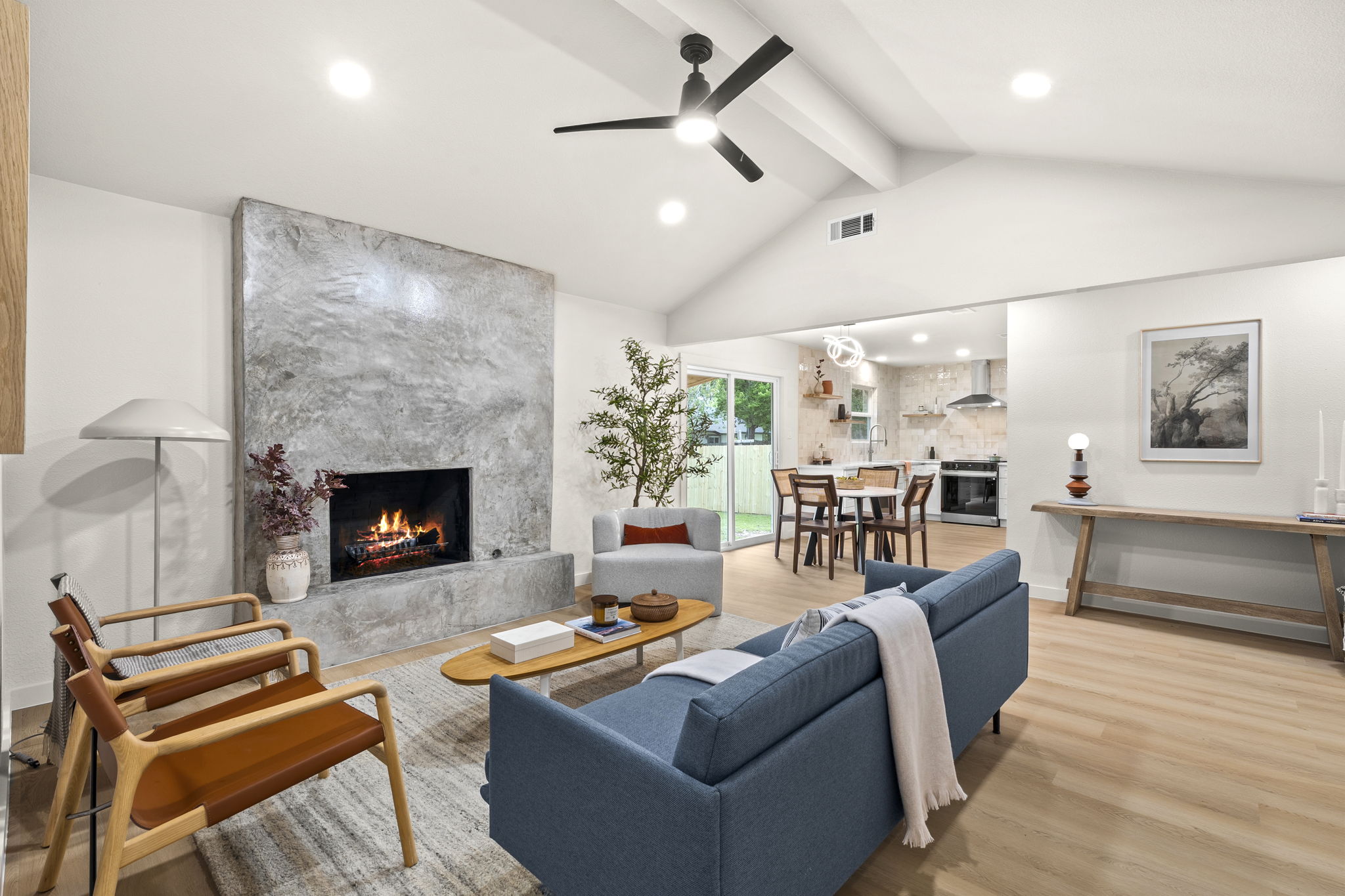 2107 Cindy Lane Austin, TX 78727 - Photo 8 of 33 Spacious living area featuring a vaulted ceiling with exposed beams