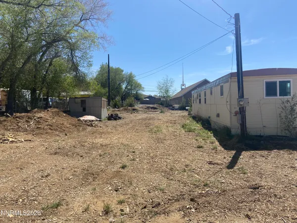 a view of a backyard of the house