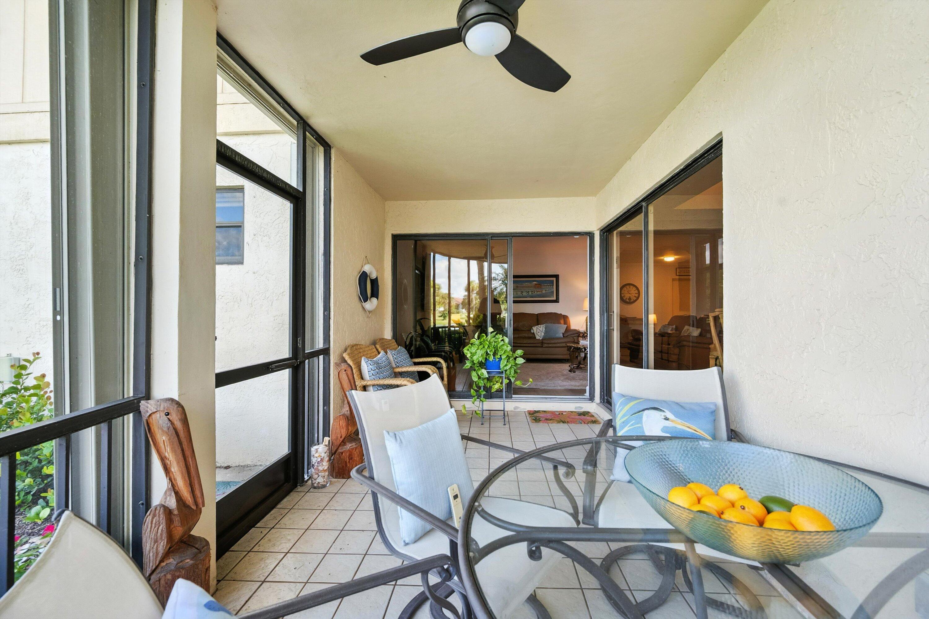 16913 Waterbend Drive, Unit 165 Jupiter, FL 33477 - Photo 26 of 39 a view of a dining room with furniture window and wooden floor