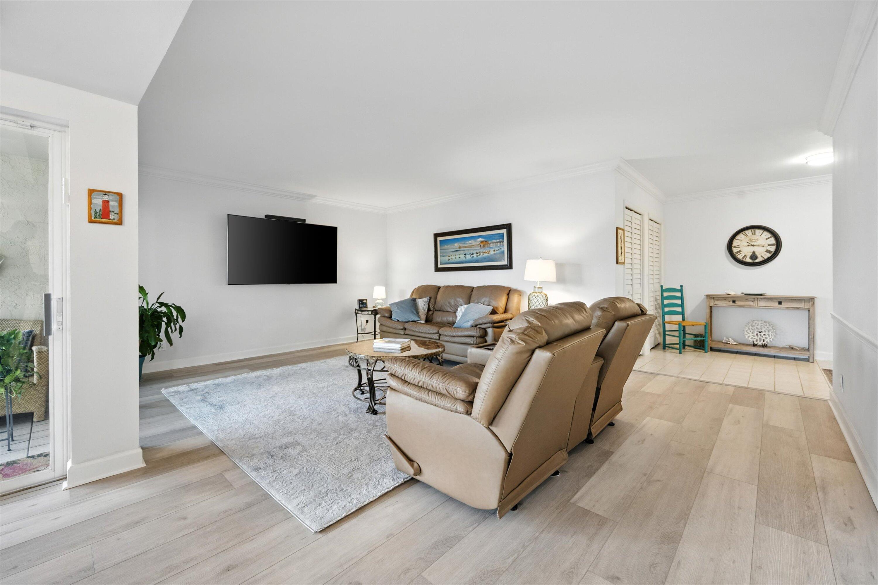 16913 Waterbend Drive, Unit 165 Jupiter, FL 33477 - Photo 6 of 39 a living room with furniture and wooden floor