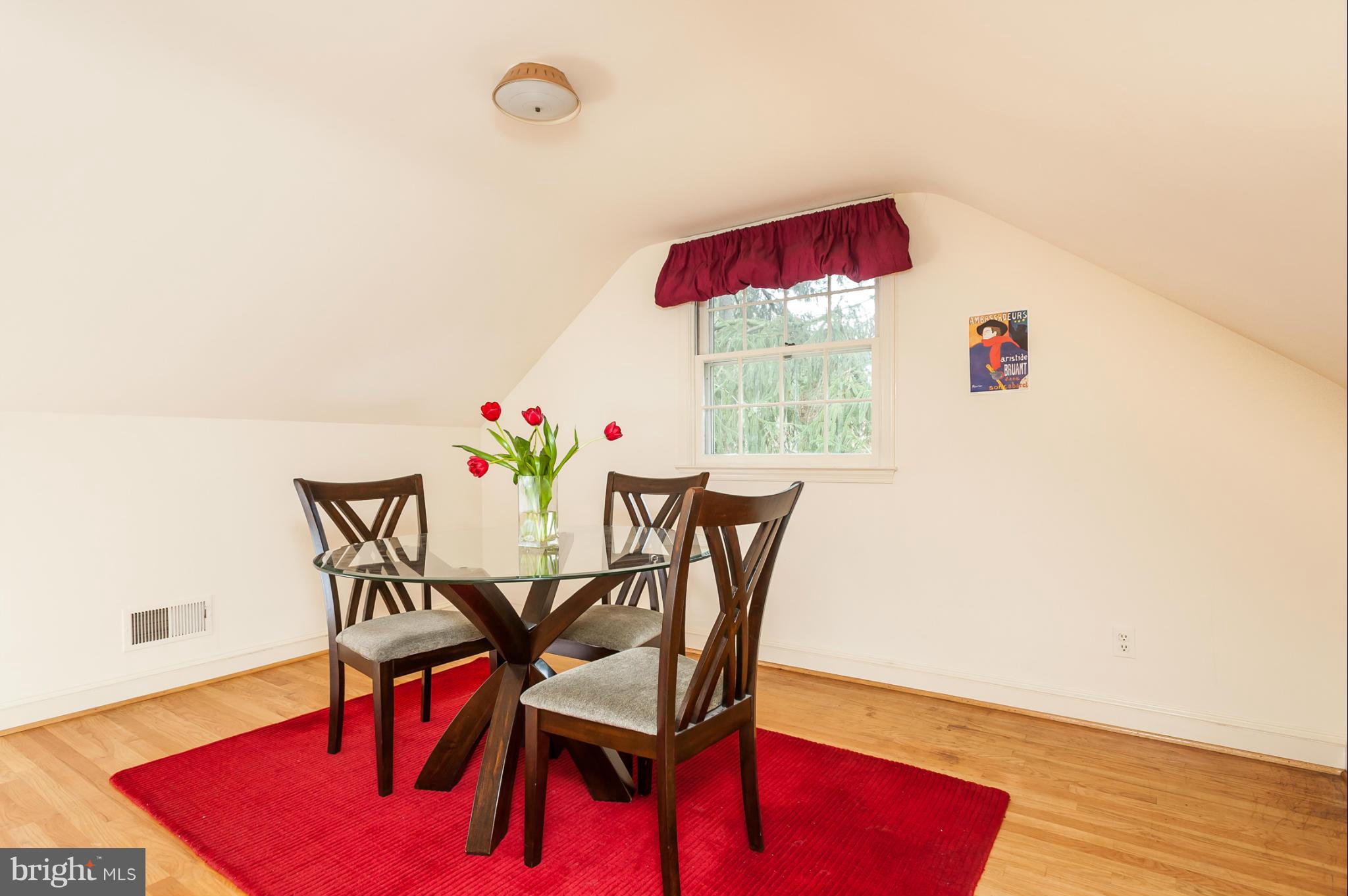 5918 Charlesmead Road Baltimore, MD 21212 - Photo 21 of 27 a view of a dining room with furniture and wooden floor