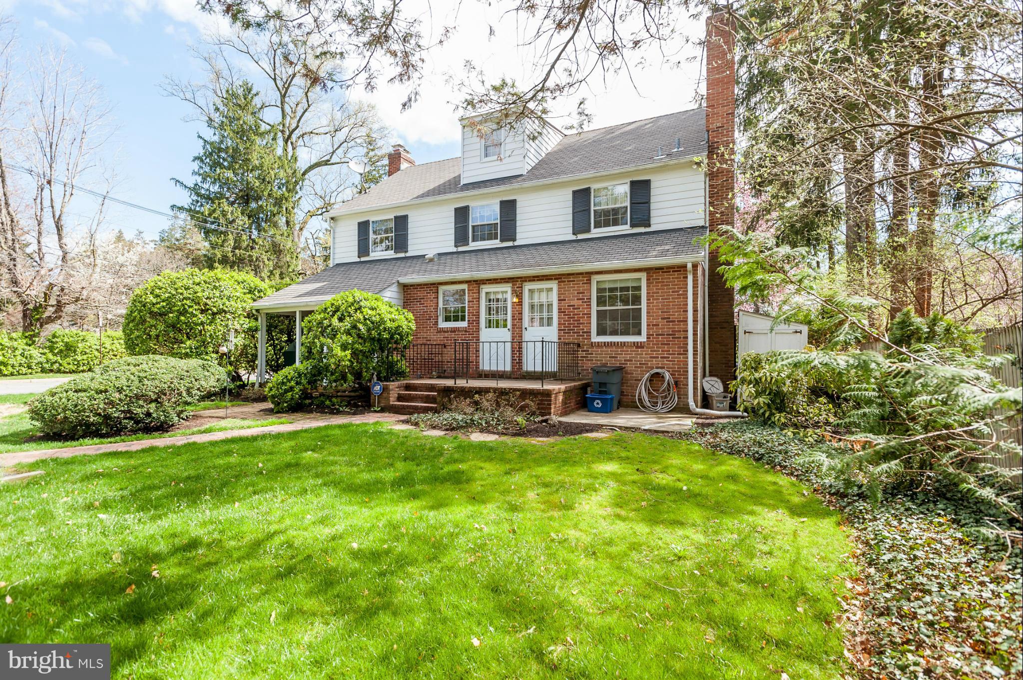 5918 Charlesmead Road Baltimore, MD 21212 - Photo 25 of 27 a view of a house with a yard patio and a large tree