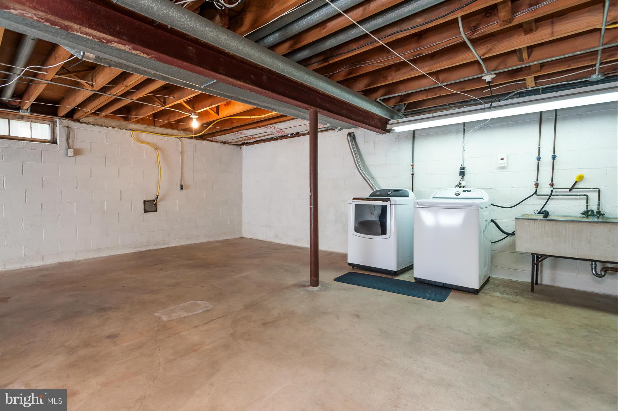 5918 Charlesmead Road Baltimore, MD 21212 - Photo 27 of 27 a kitchen with a stove and a table