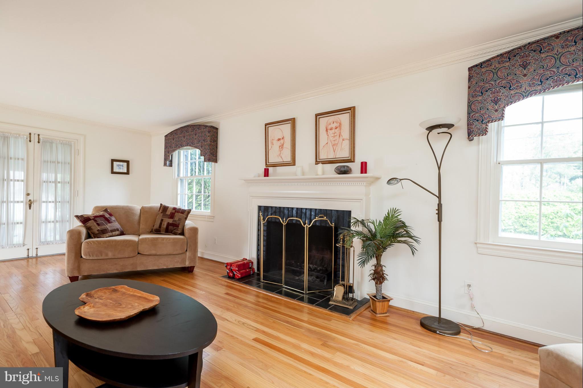 5918 Charlesmead Road Baltimore, MD 21212 - Photo 5 of 27 a living room with furniture and a fireplace