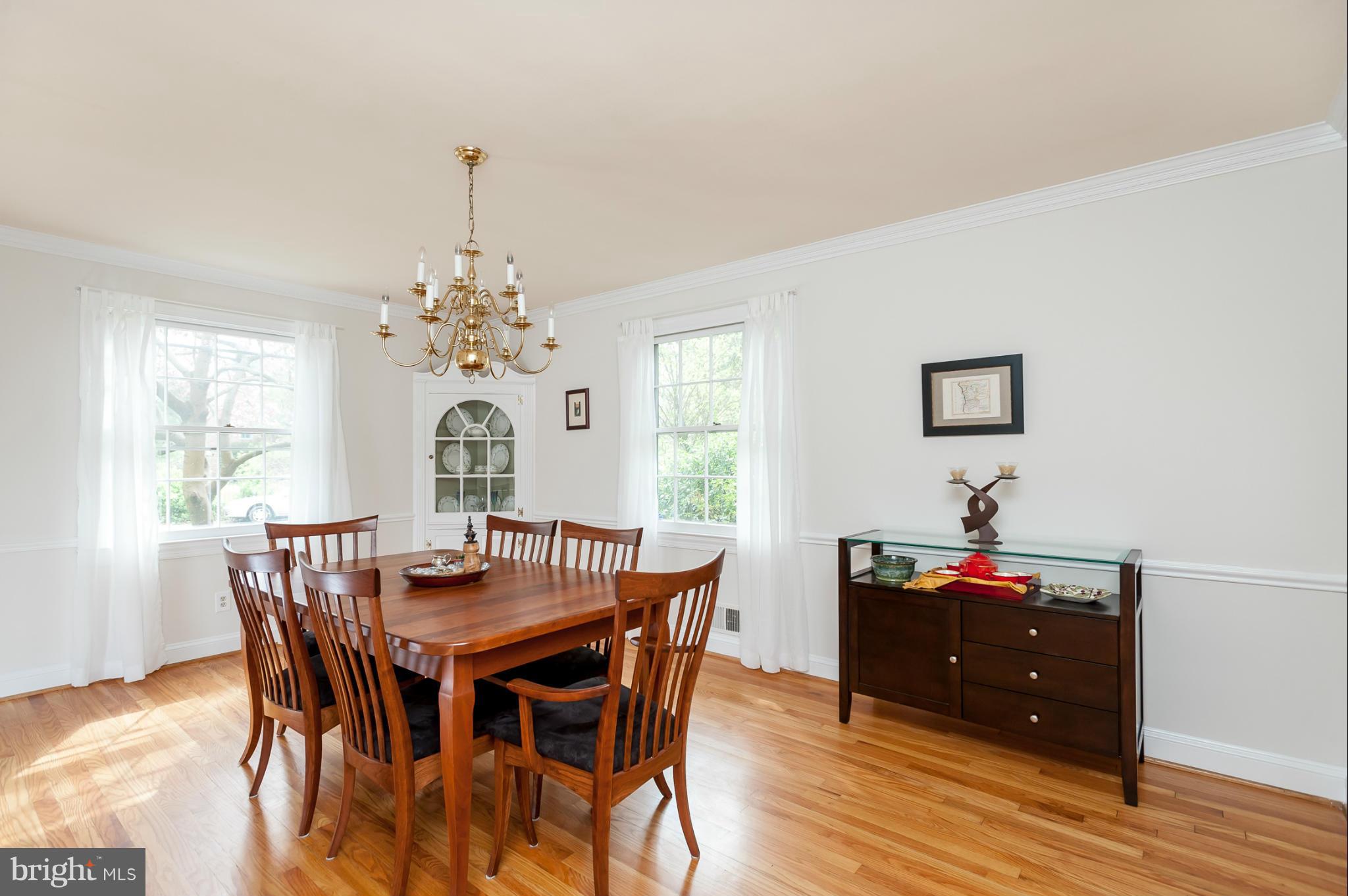 5918 Charlesmead Road Baltimore, MD 21212 - Photo 6 of 27 a view of a dining room with furniture window and wooden floor