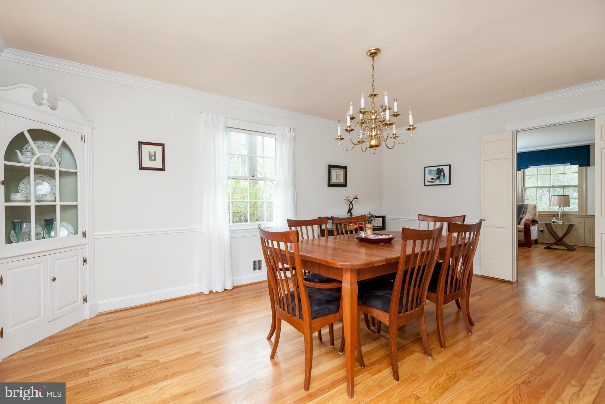 5918 Charlesmead Road Baltimore, MD 21212 - Photo 7 of 27 a view of a dining room with furniture window and wooden floor