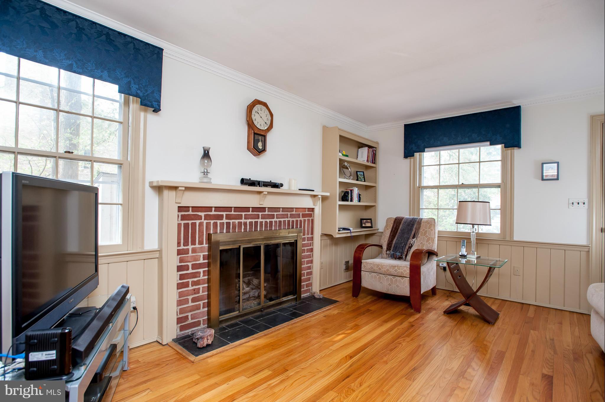 5918 Charlesmead Road Baltimore, MD 21212 - Photo 8 of 27 a living room with furniture and a fireplace