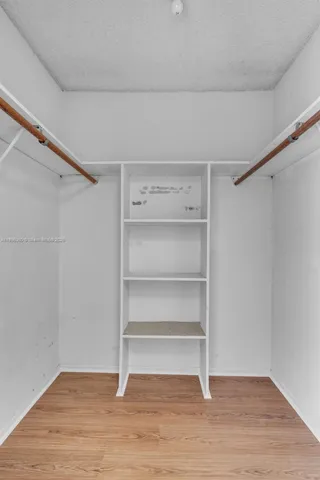 a view of an empty walk in closet