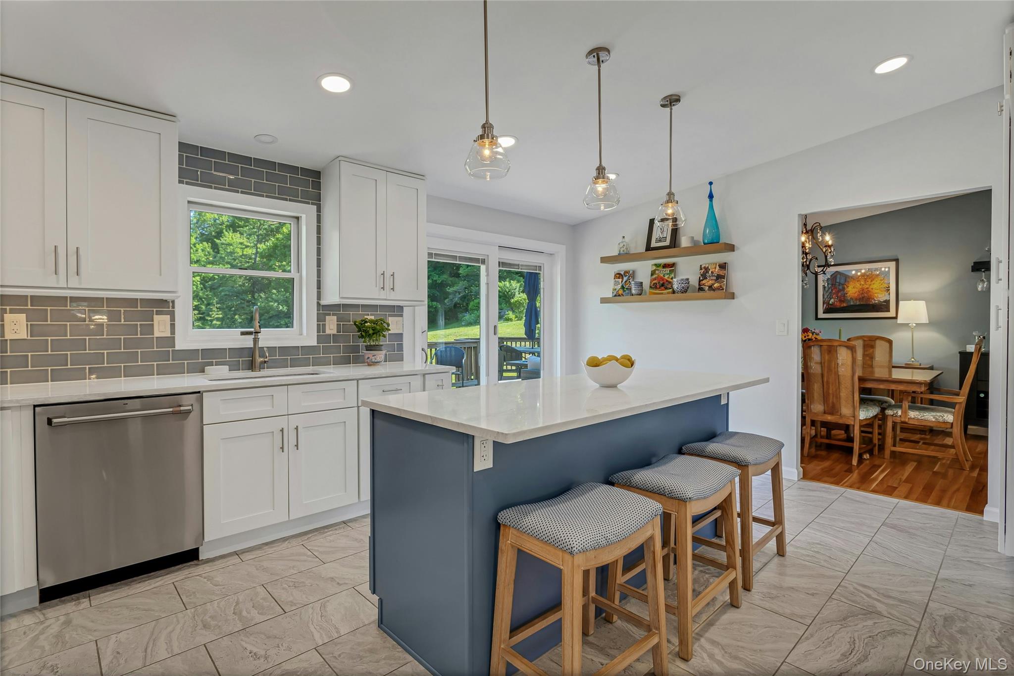 340 Osceola Road Jefferson Valley, NY 10535 - Photo 16 of 48 a kitchen with a sink window and chairs