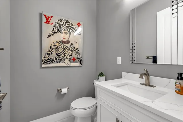 a bedroom with a bed dresser and window