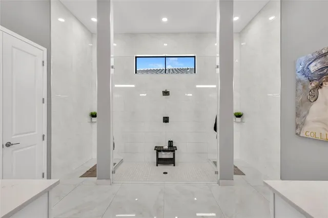 a view of a swimming pool with a table and chairs