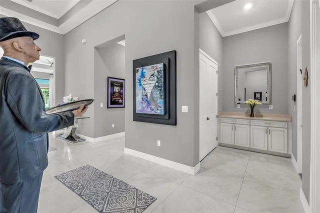 a kitchen with counter top space and living room