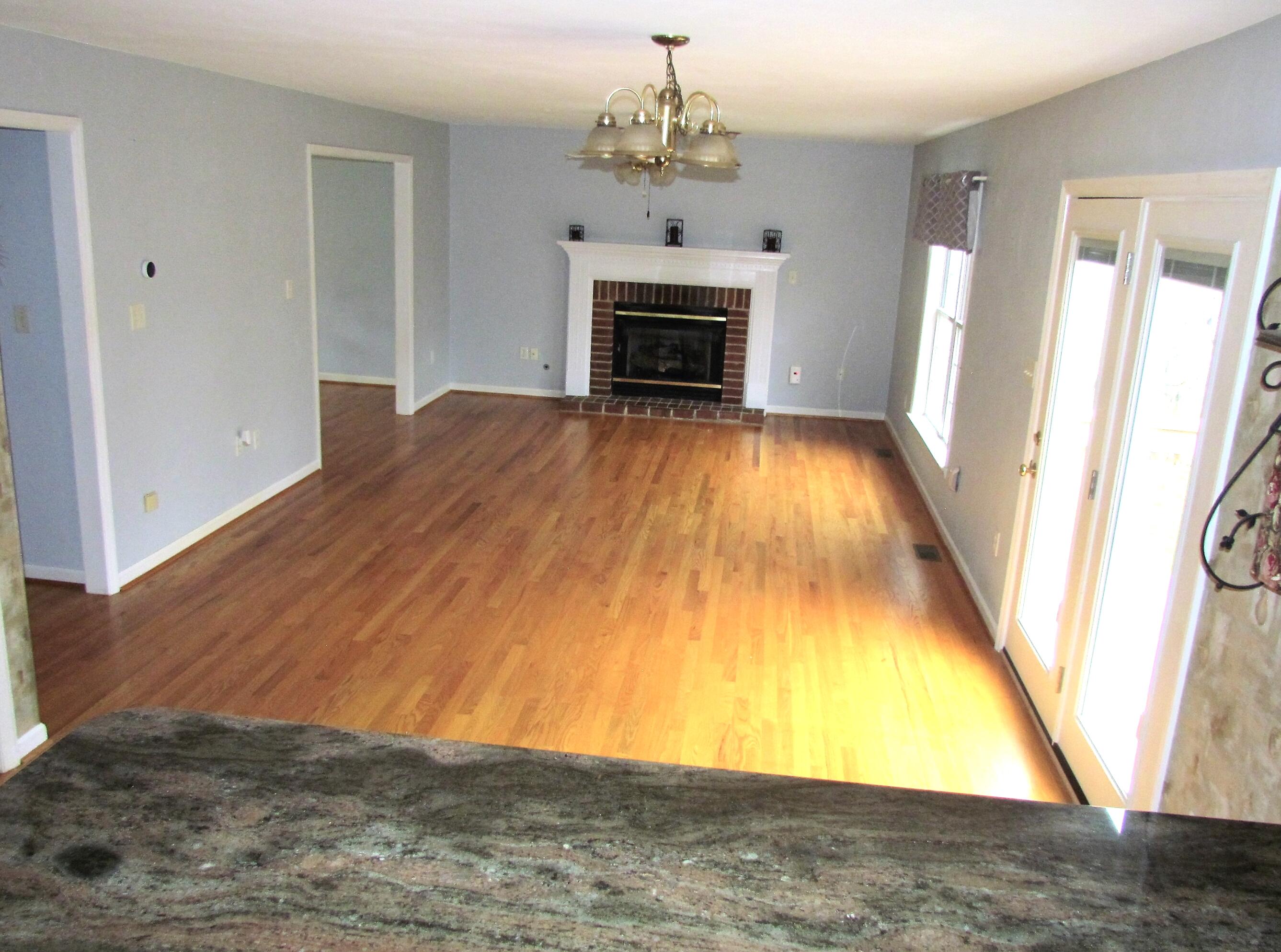 1333 Archway Road Blue Ridge, VA 24064 - Photo 12 of 37 a view of an empty room with wooden floor and a window