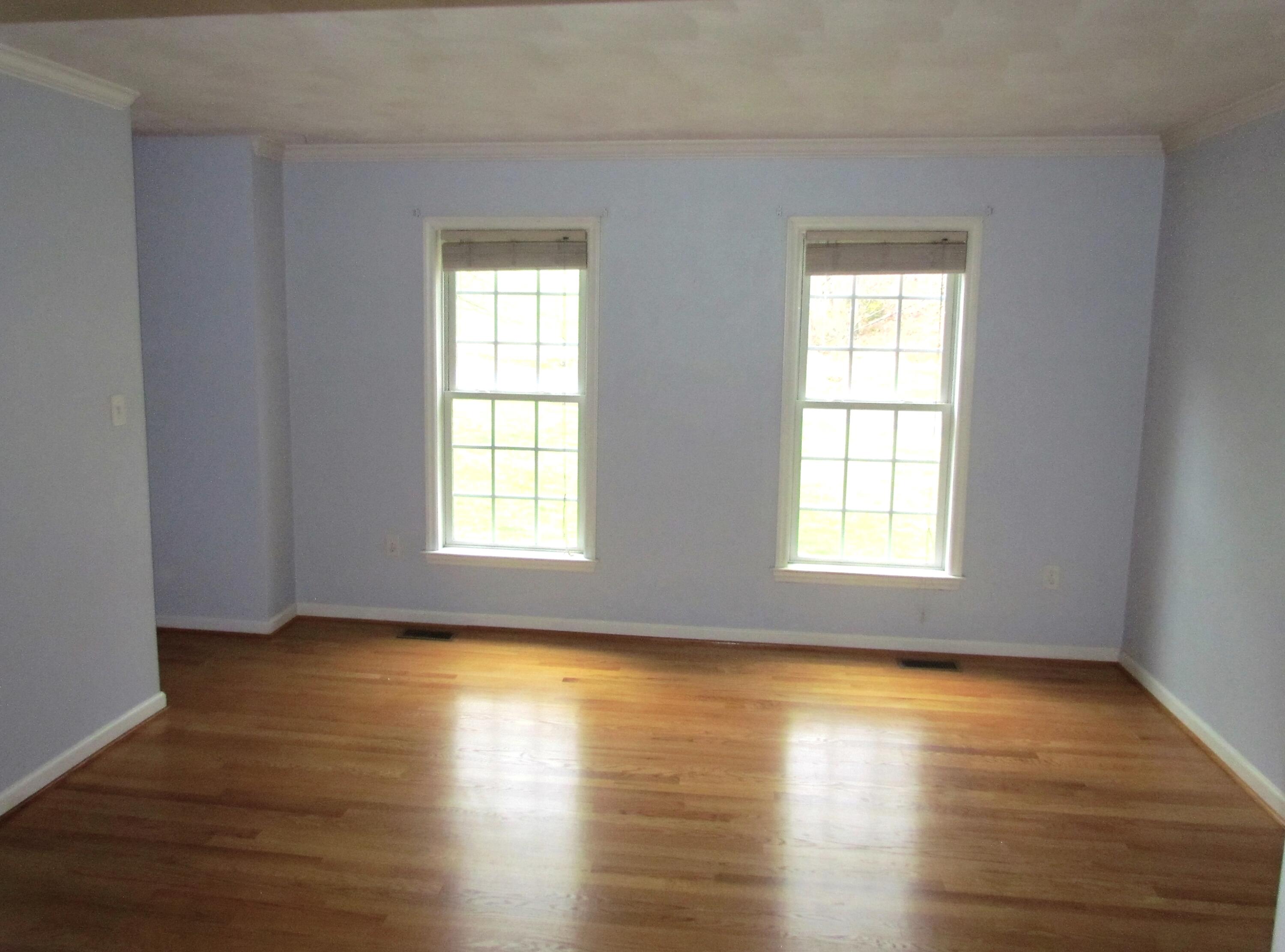 1333 Archway Road Blue Ridge, VA 24064 - Photo 7 of 37 a view of an empty room with wooden floor and a window