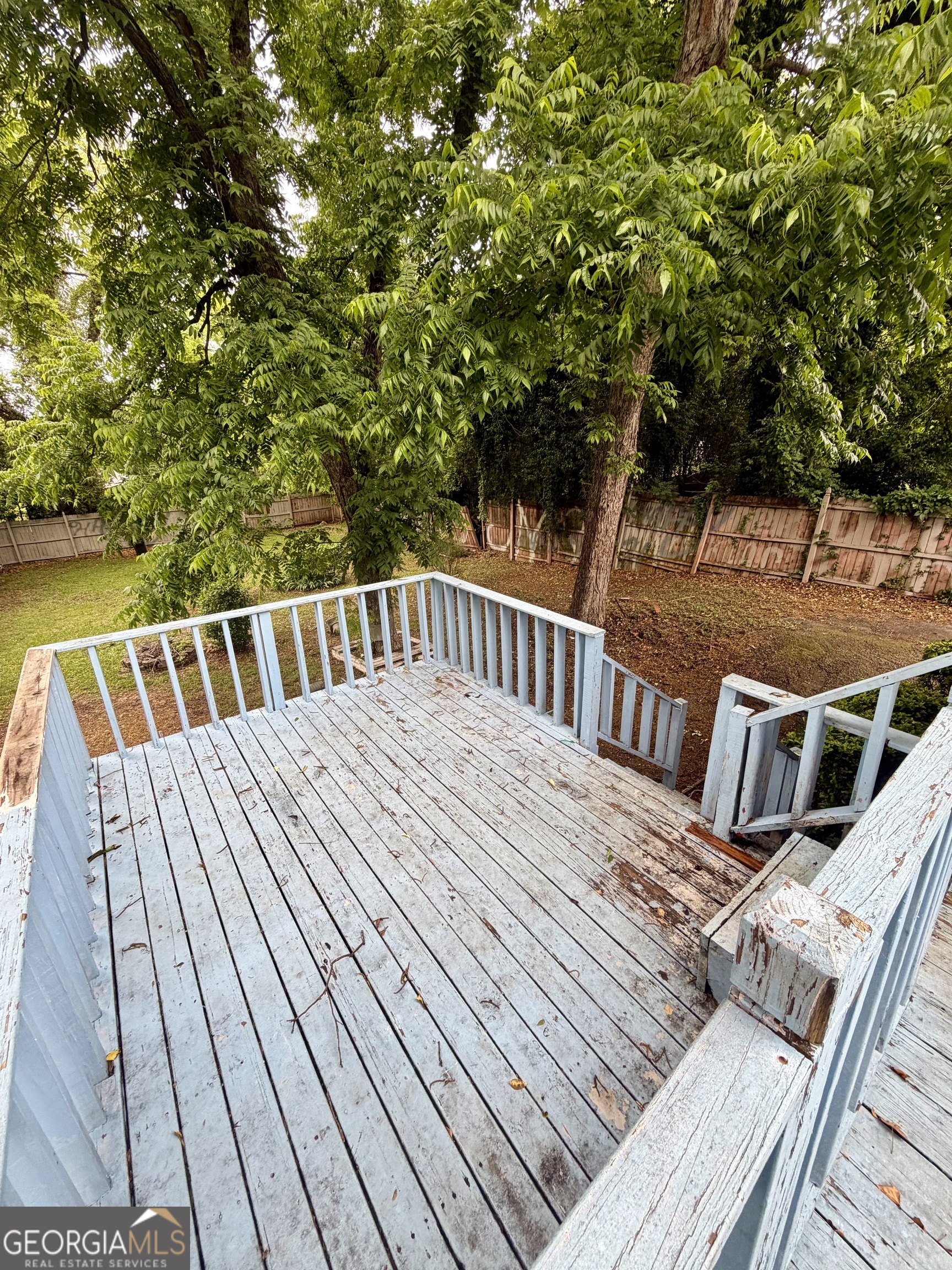666 Woolfolk Street Macon, GA 31217 - Photo 52 of 60 a view of balcony with deck and wooden floor