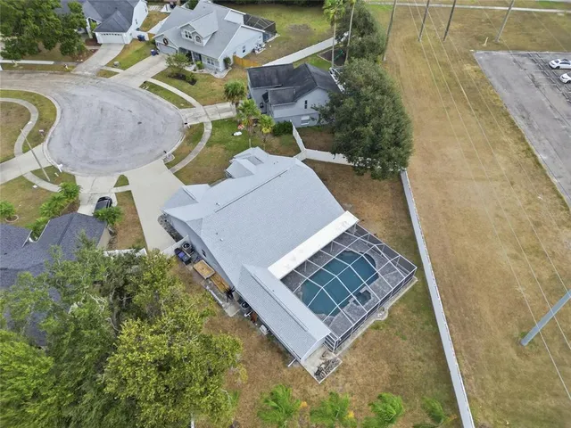 a front view of house with yard and trees