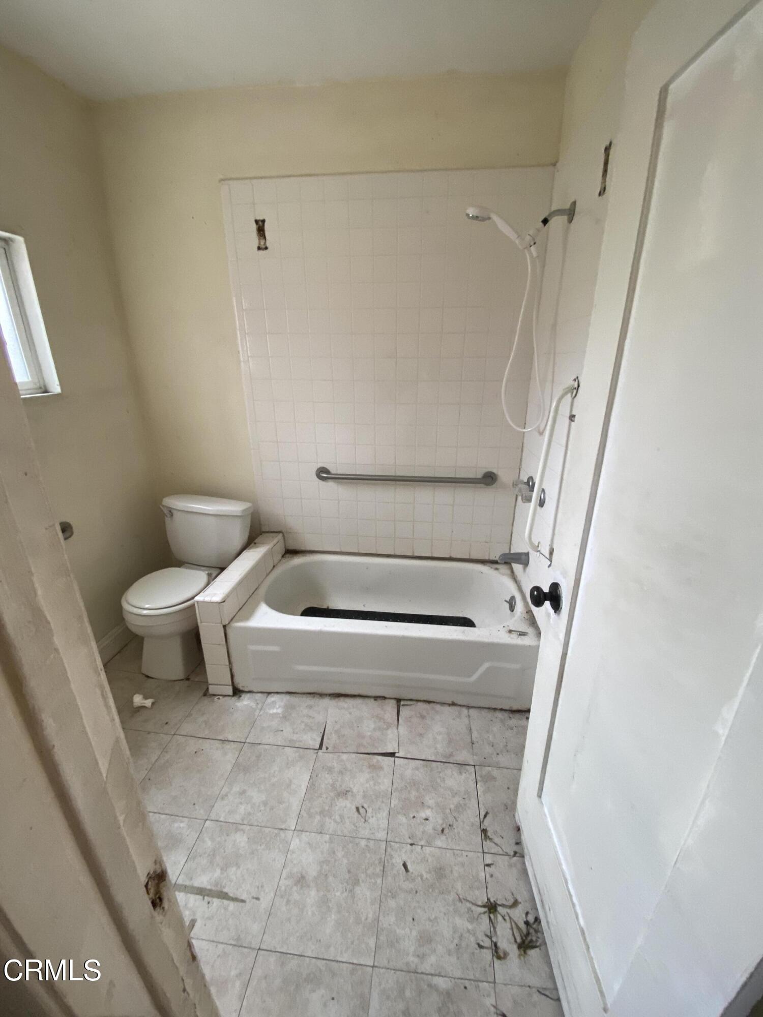 11210 Oak Street El Monte, CA 91731 - Photo 12 of 15 a bathroom with a toilet and a shower