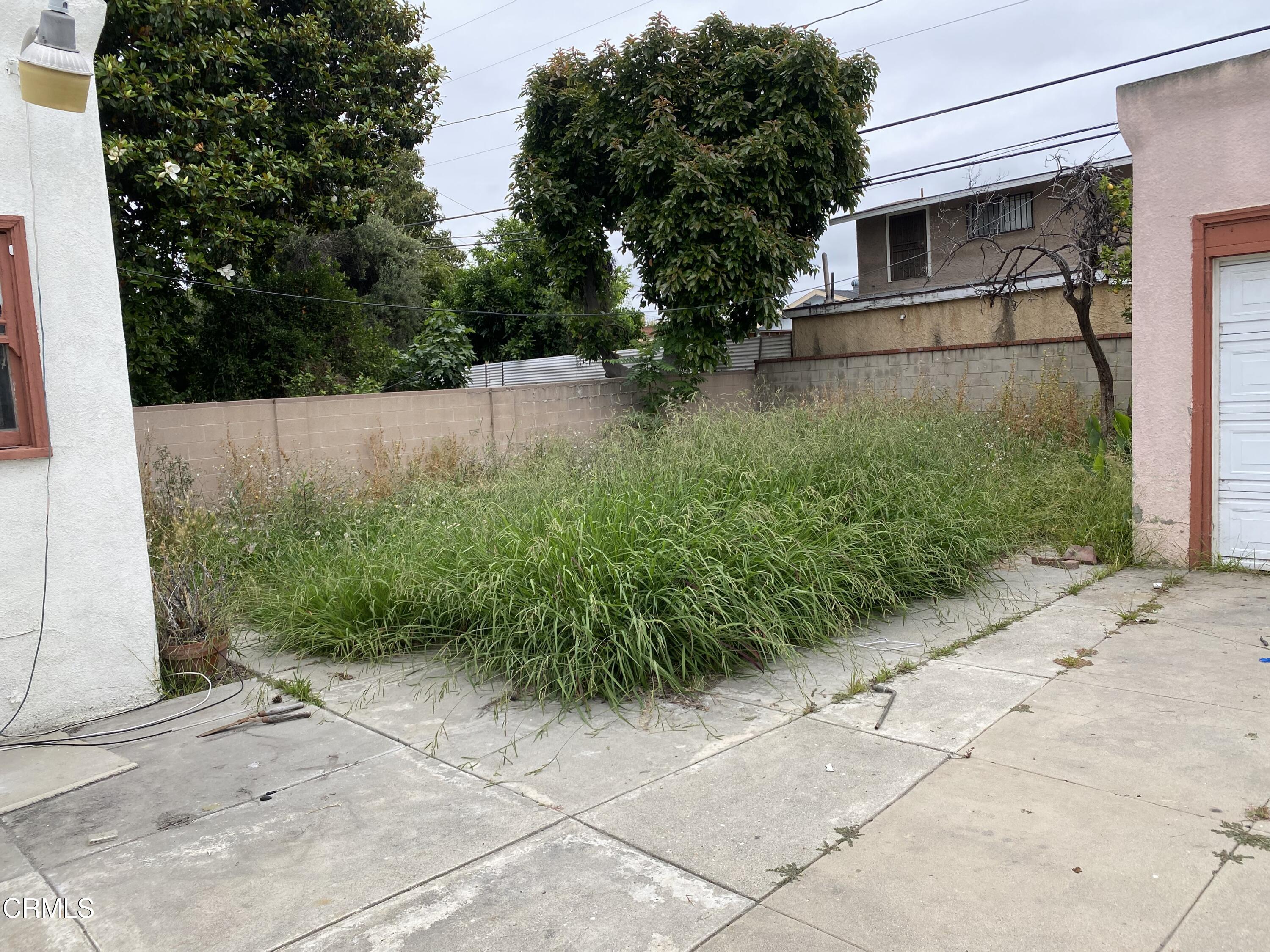 11210 Oak Street El Monte, CA 91731 - Photo 13 of 15 a backyard of a house with lots of green space