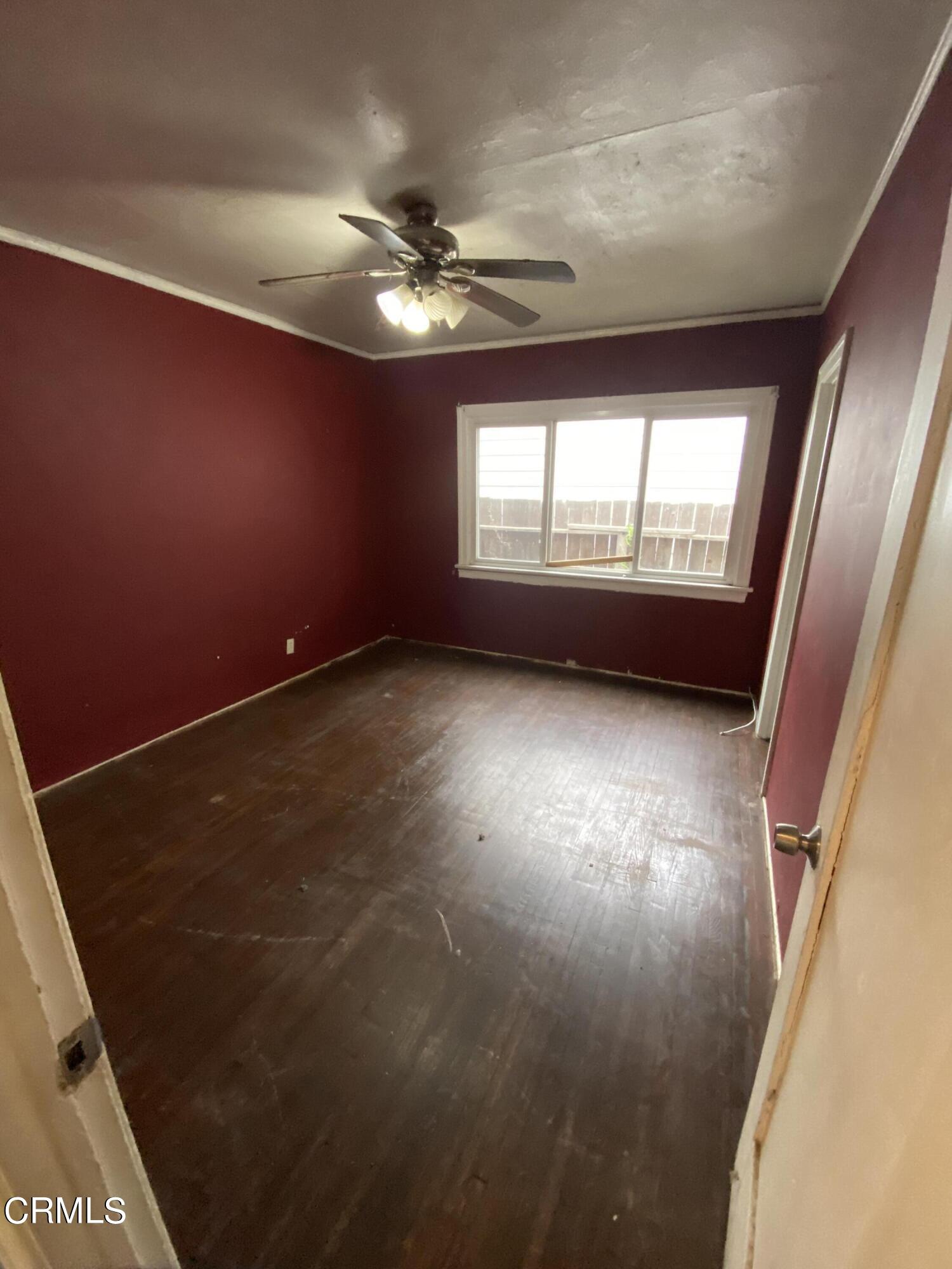 11210 Oak Street El Monte, CA 91731 - Photo 7 of 15 en empty room with windows and ceiling fan