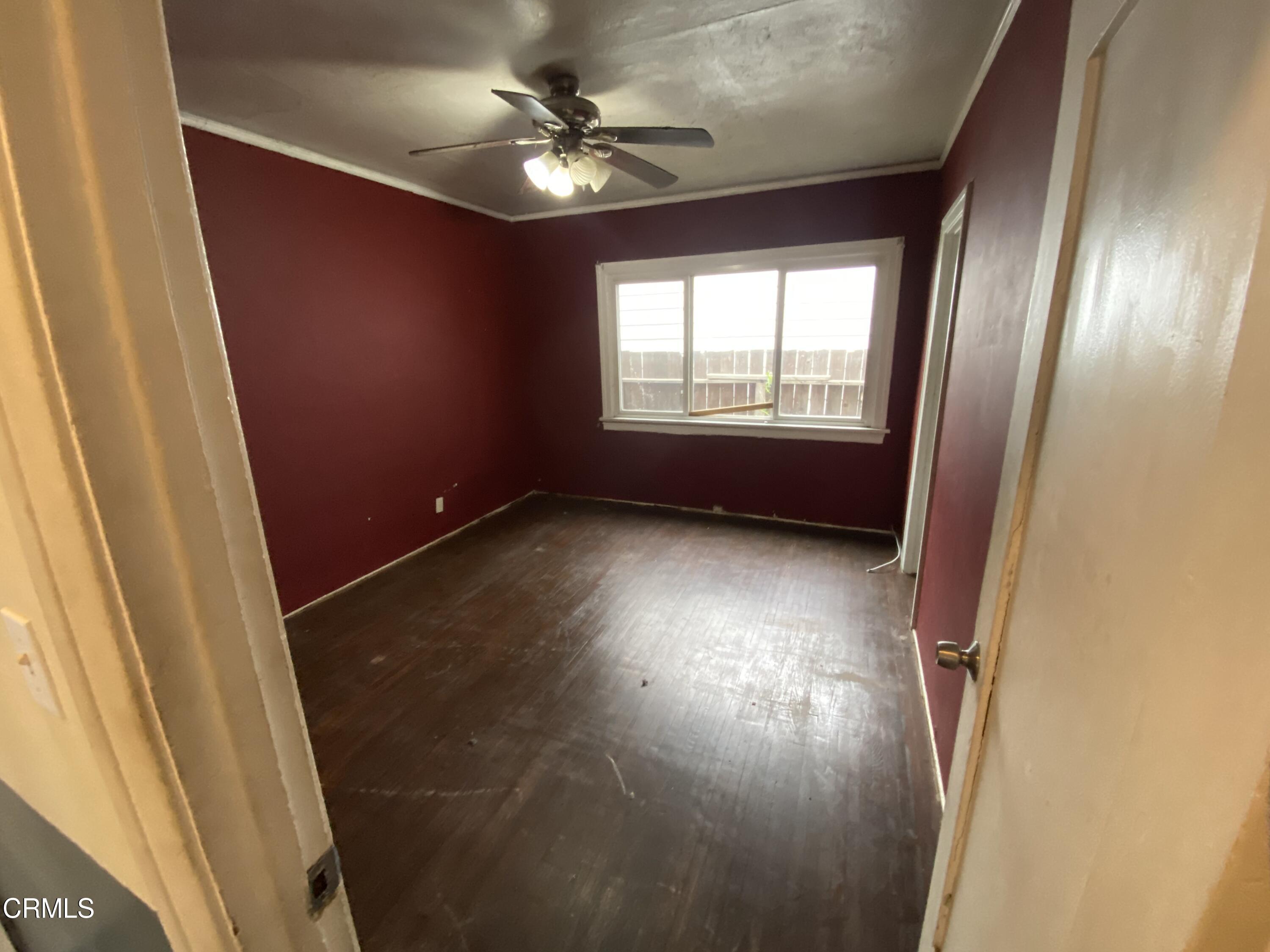 11210 Oak Street El Monte, CA 91731 - Photo 8 of 15 an empty room with wooden floor and windows