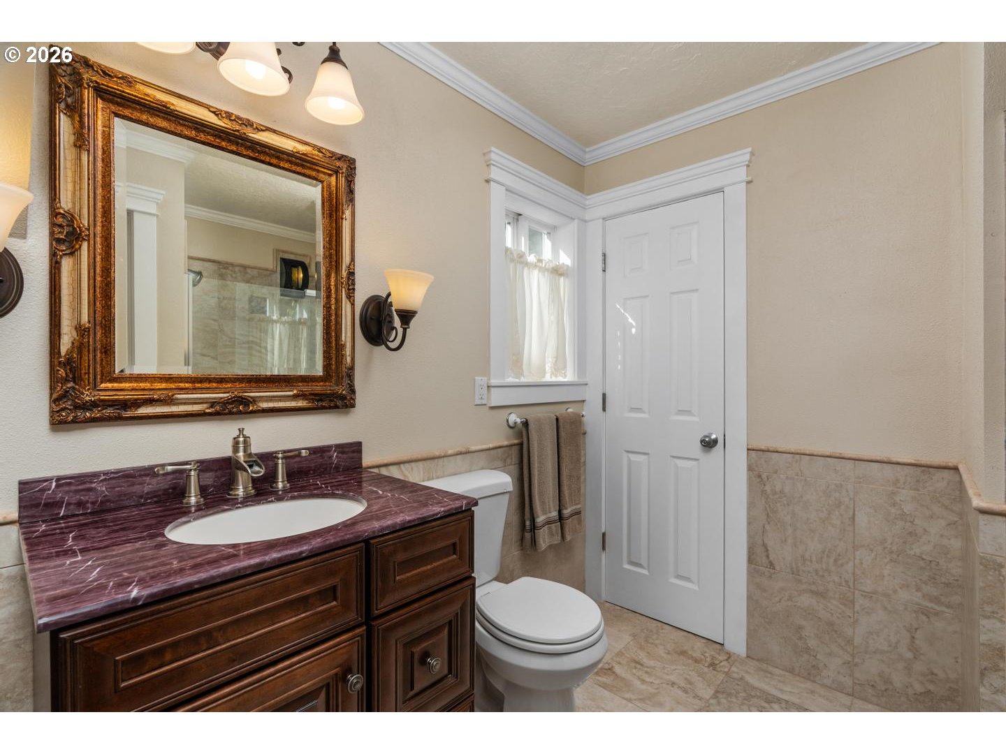 16042 Southwest Waxwing Way Beaverton, OR 97007 - Photo 31 of 48 a bathroom with a granite countertop sink toilet a mirror and shower